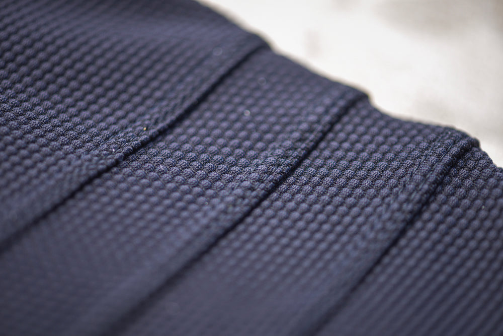 Made from ECONYL® regenerated Nylon this special Italian fabric has a three-dimensional honeycomb texture. OEKO-TEX® Standard 100 and Global Recycled Standard certified.